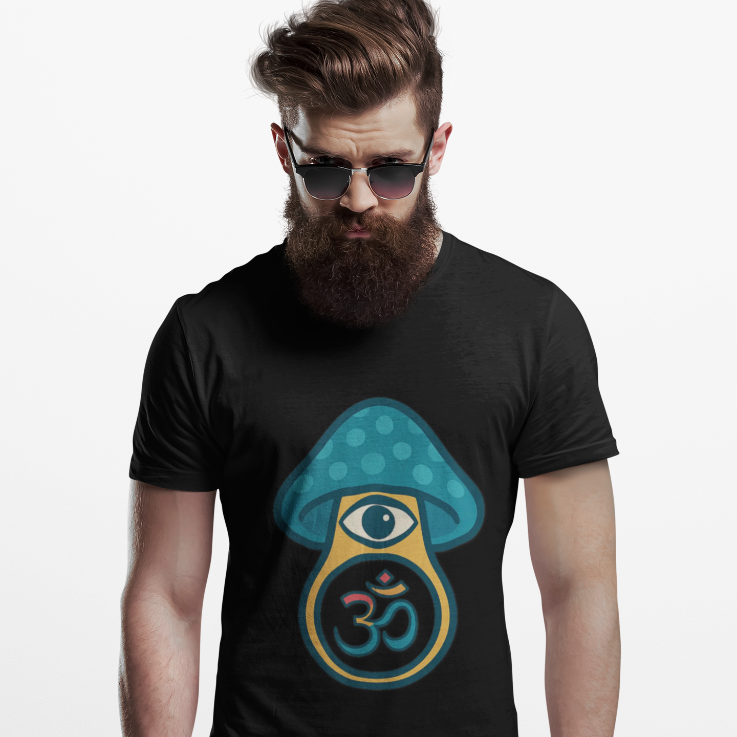 Man wearing a black t-shirt with a blue and green mushroom design featuring an eye and om symbol.